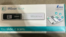 Retail packaging for the IRIScan Book 5 portable scanner showing the "You slide, it scans" slogan and highlighting its 1200DPI capability.